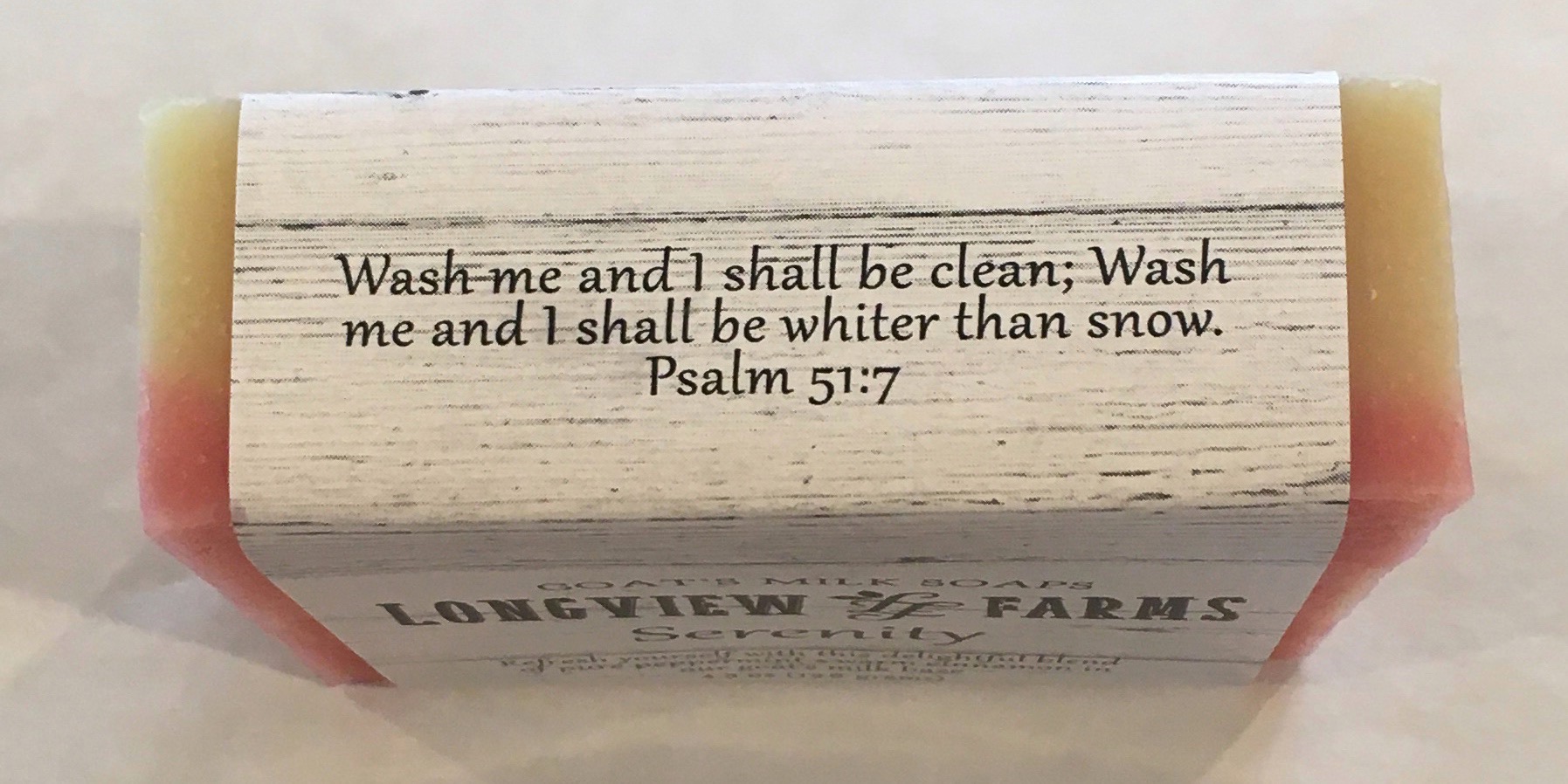 A wooden sign with Psalm 51:7 engraved on it.