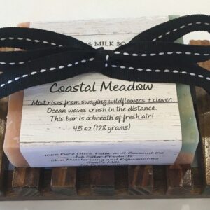 A box of Coastal Meadow mini soaps with a black ribbon.