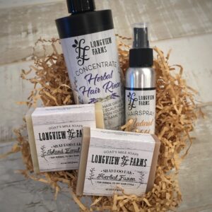 Natural skincare set with lavender-sage soap and herbal spray in rustic packaging.